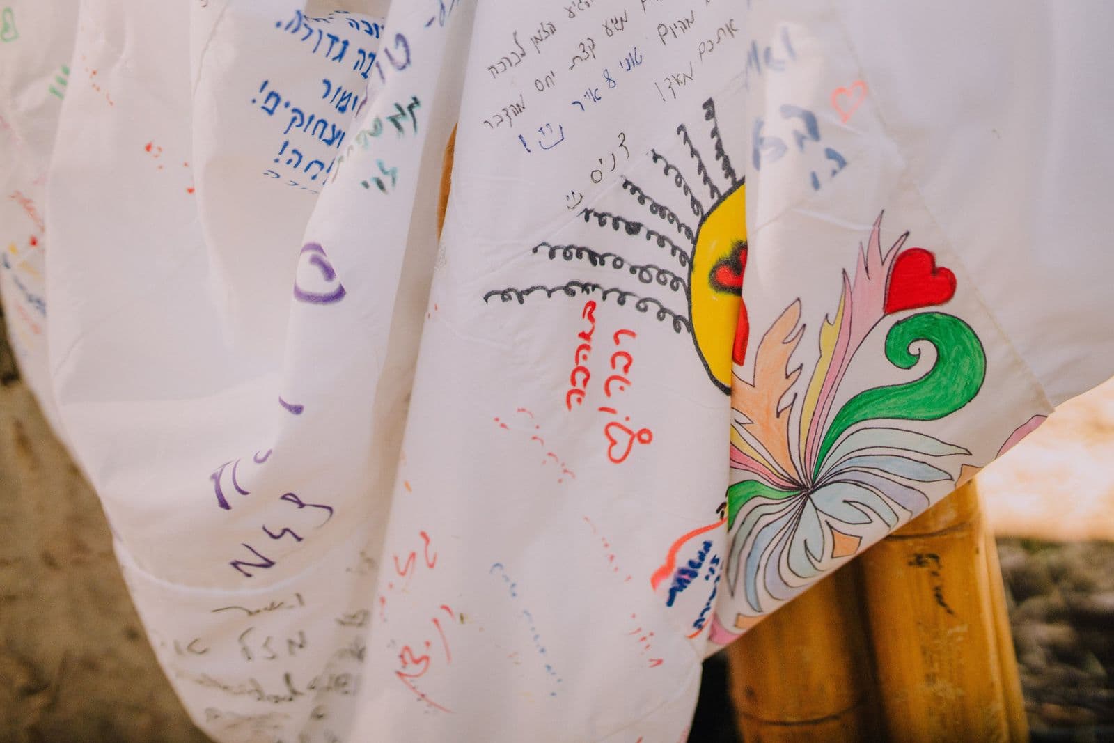 Hand-written notes and illustrations laid out on a wedding table